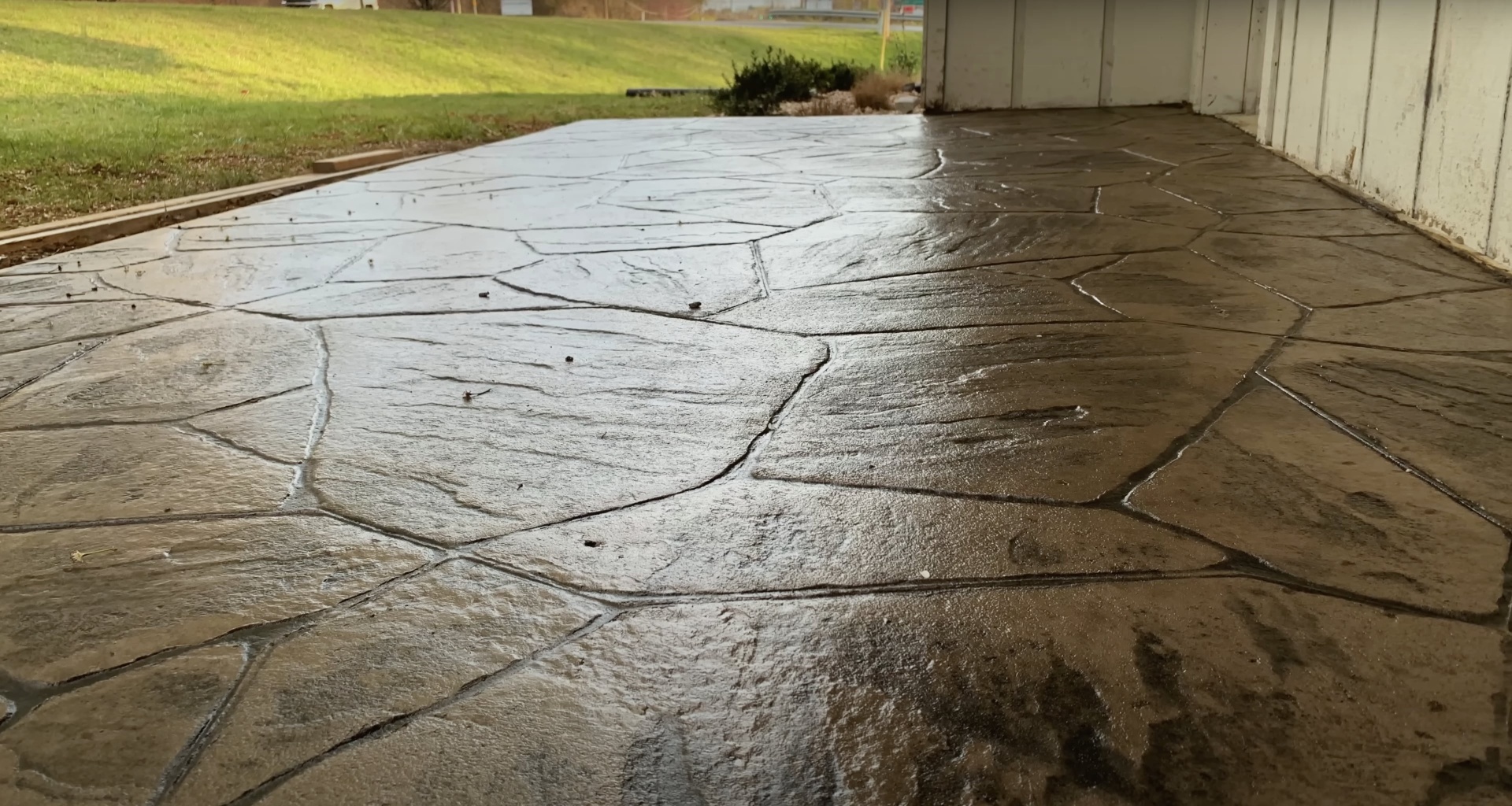 Concrete repair project - damaged driveway before Henderson Concrete Pros restoration Damaged concrete driveway with cracks and wear showing need for professional repair in Henderson, KY