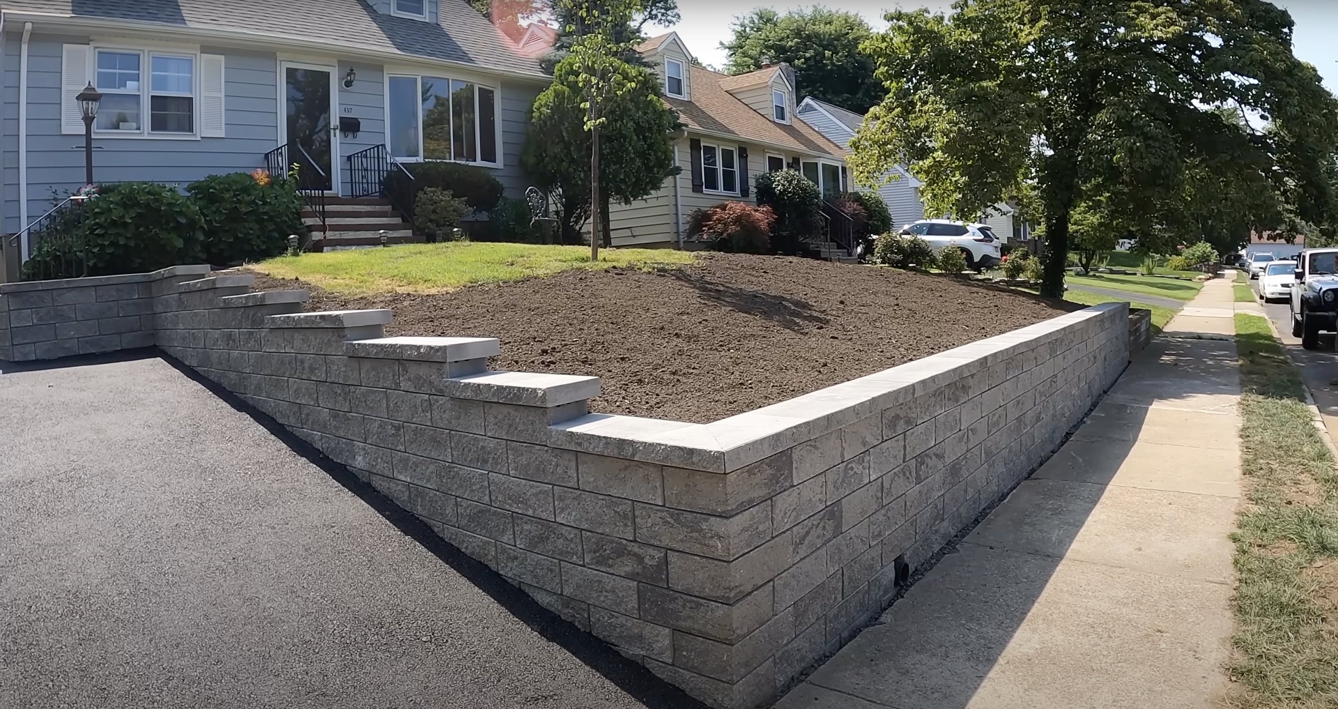 Quality retaining wall construction by Henderson Concrete Pros Professional concrete retaining wall construction showing expert masonry work in Henderson, KY