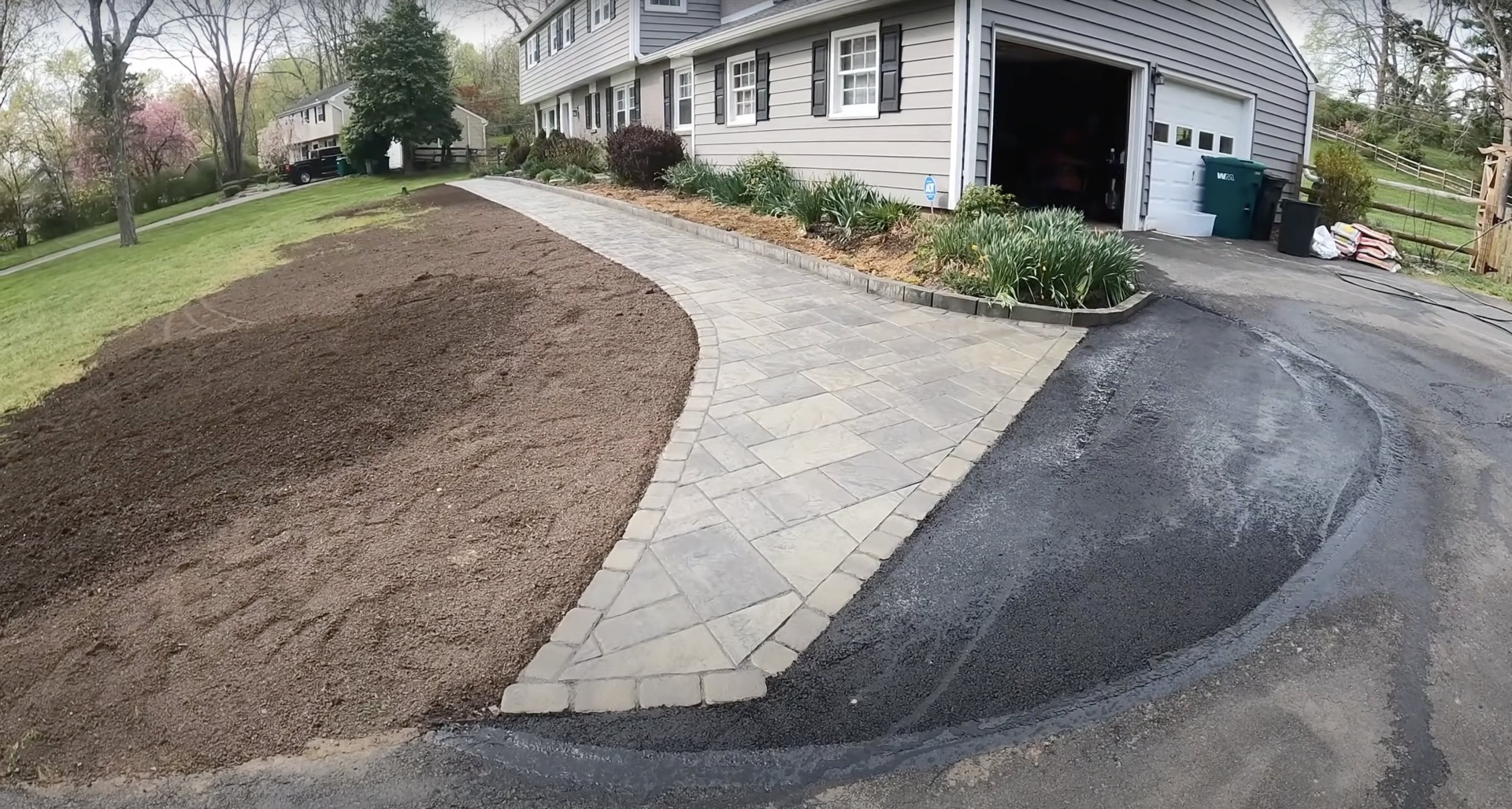 Decorative concrete walkway and driveway project by Henderson Concrete Pros Elegant paver-style concrete walkway and driveway installation at residential home in Henderson, KY